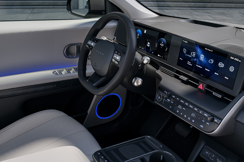 Interior view of the 2026 Hyundai IONIQ 5 with digital cockpit, ambient lighting, and dual touchscreen displays