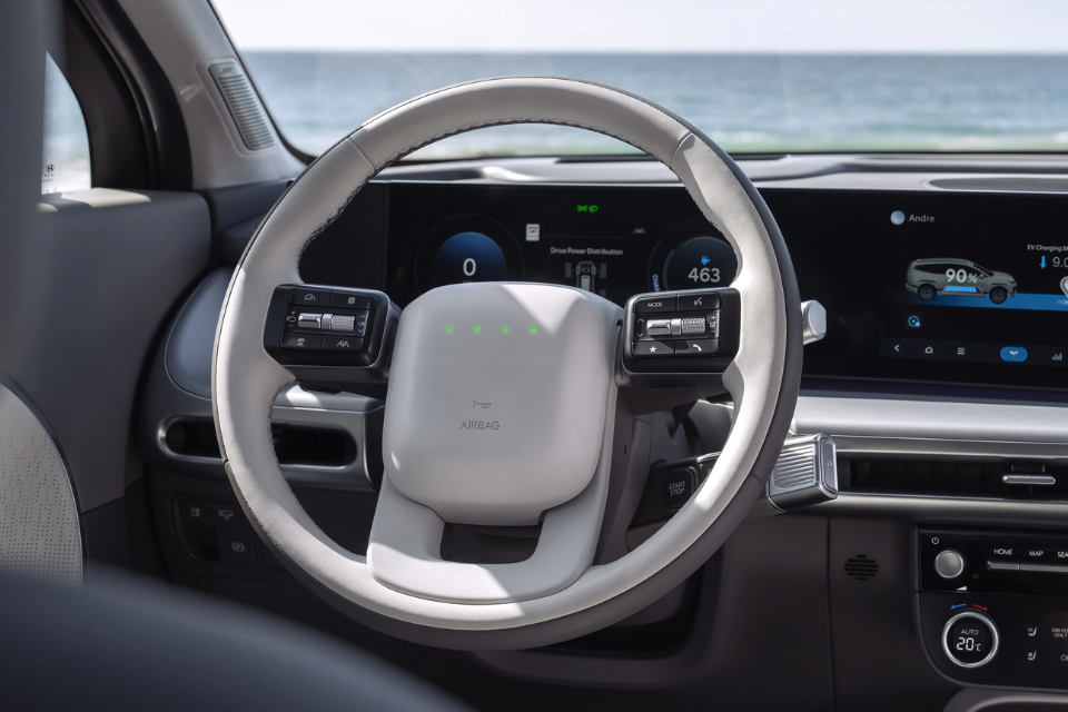 Driver’s cockpit of the 2026 Hyundai IONIQ 9 with digital displays and a futuristic steering wheel design