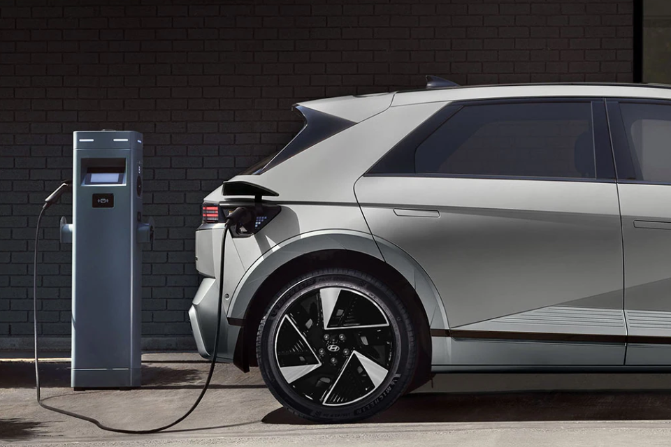 2026 Hyundai IONIQ 5 plugged into a public EV charger, highlighting its efficient electric charging capability
