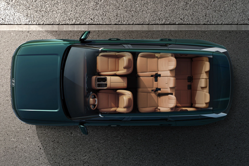 Top-down view of the Hyundai Palisade Hybrid interior showing three rows of seating and spacious cabin layout.