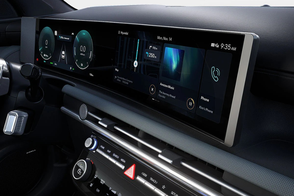 Wide digital instrument cluster and infotainment display inside the 2026 Hyundai Tucson Hybrid.