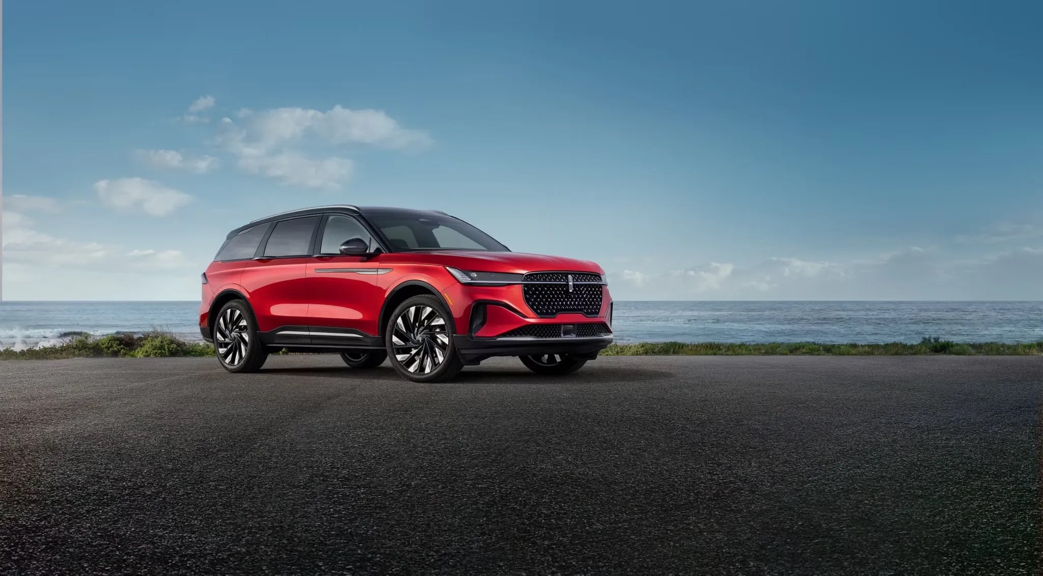 2026 Lincoln Nautilus red luxury SUV parked on open road exterior view