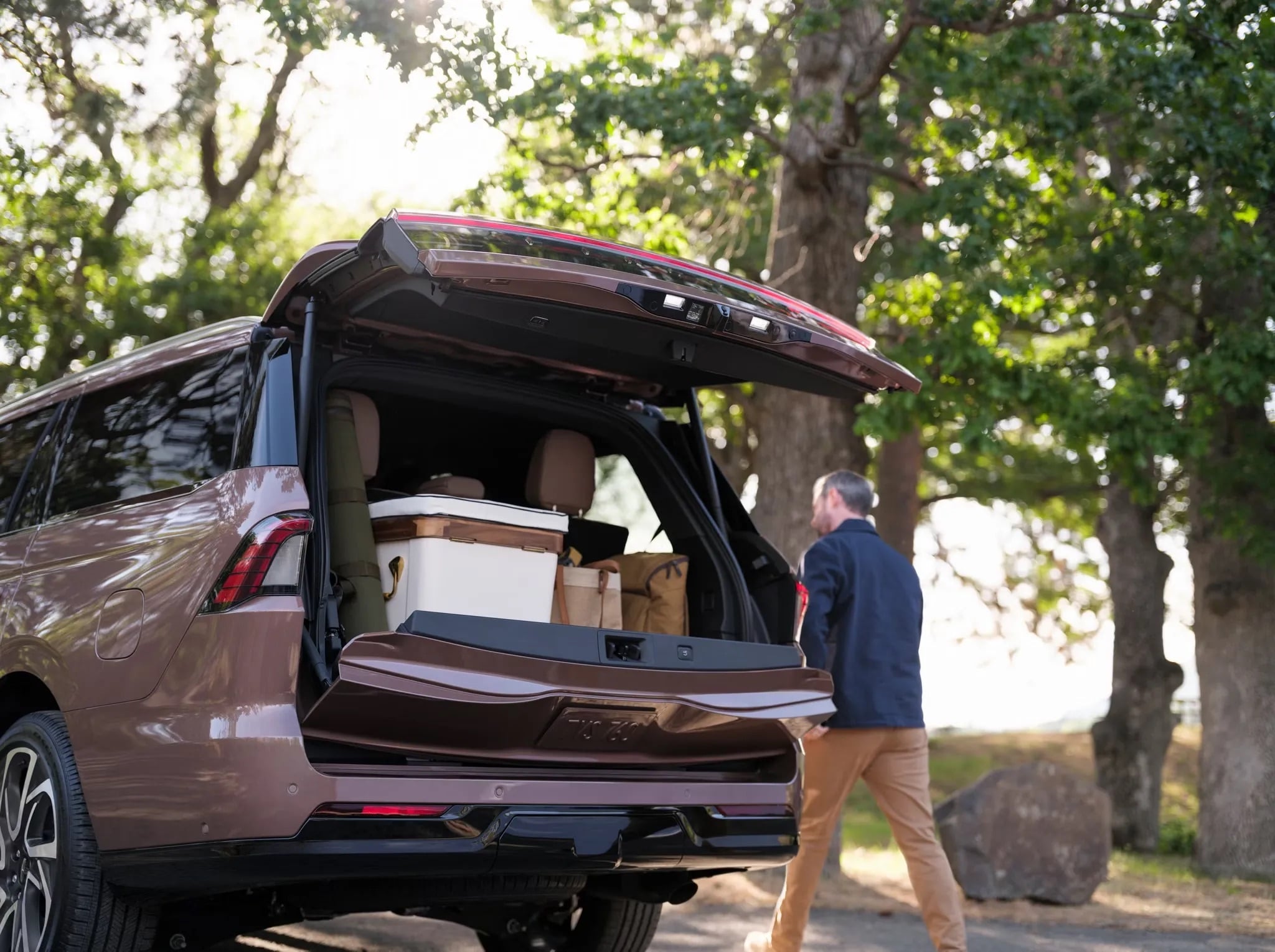 2026 Lincoln Navigator cargo area open with family loading gear into rear hatch