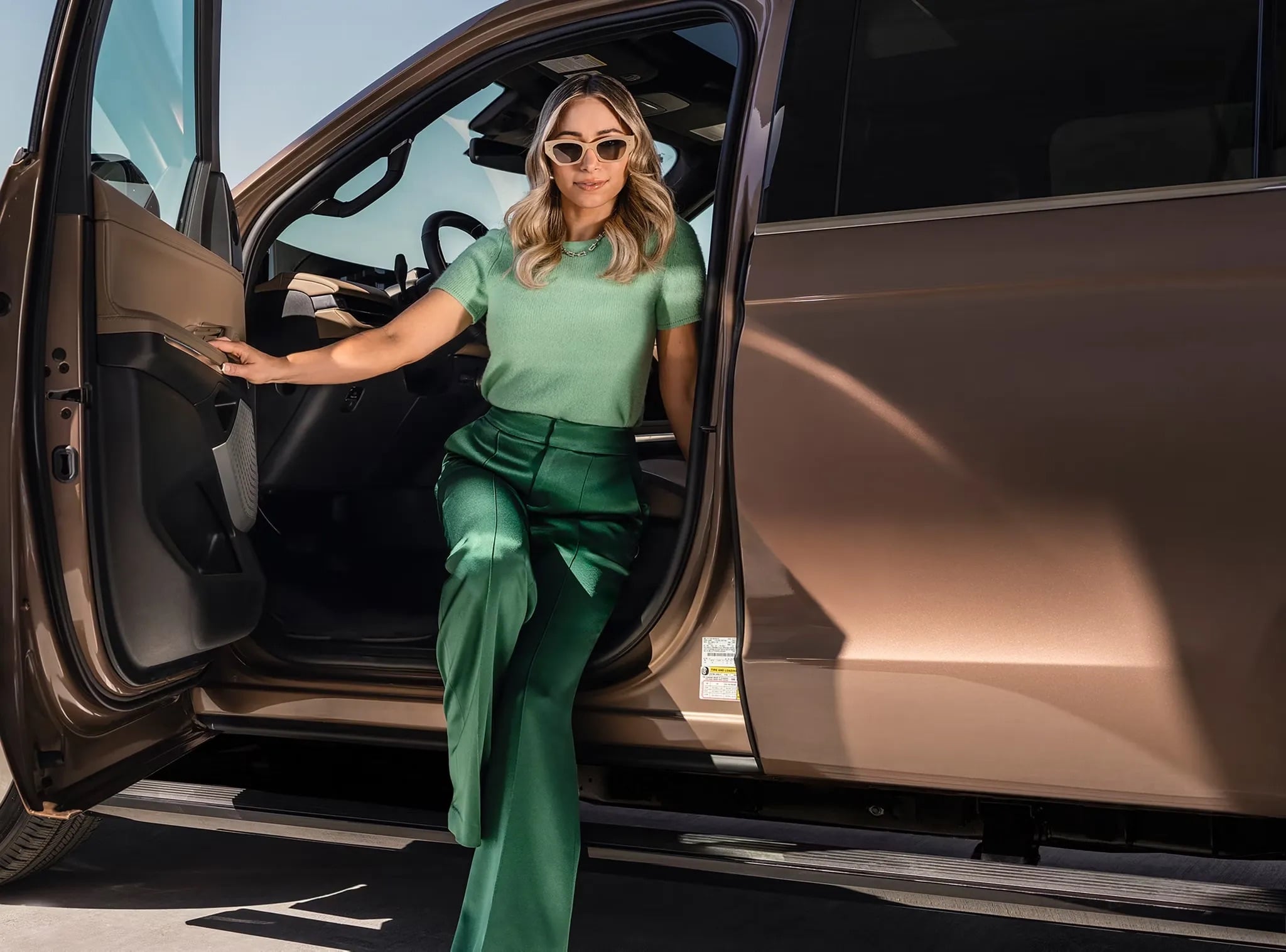2026 Lincoln Navigator passenger stepping out of luxury SUV exterior lifestyle