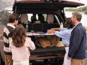 2026 Lincoln Navigator family loading cargo into rear hatch lifestyle shot