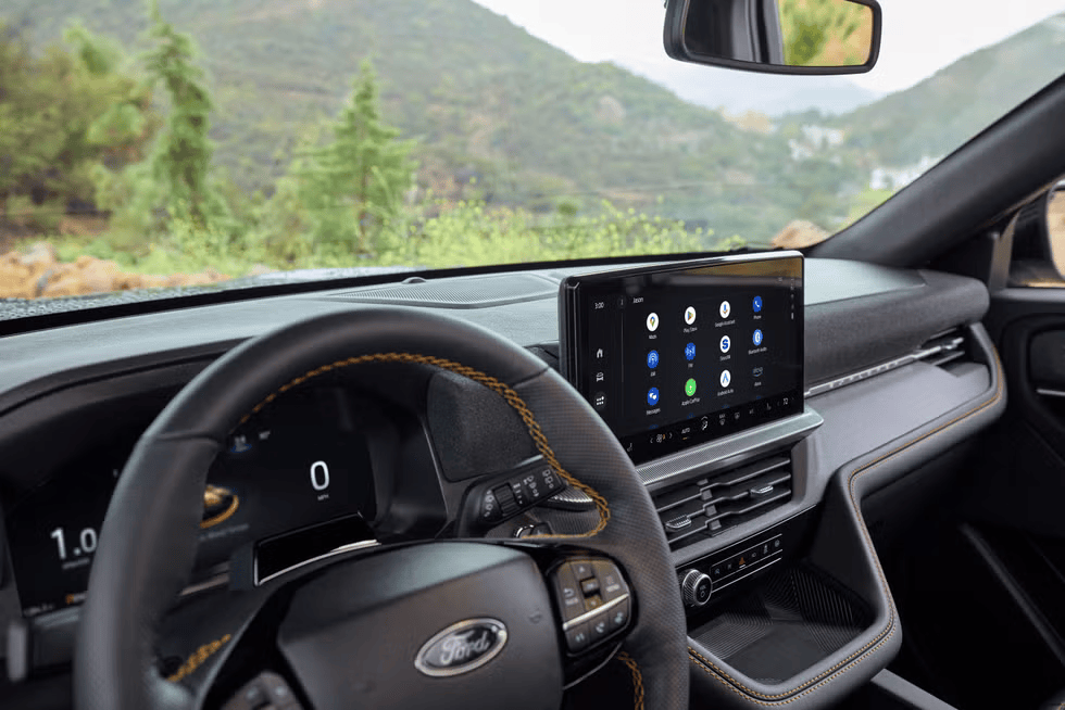 Interior of a Ford vehicle with digital dash and touchscreen display at Freedom Ford.