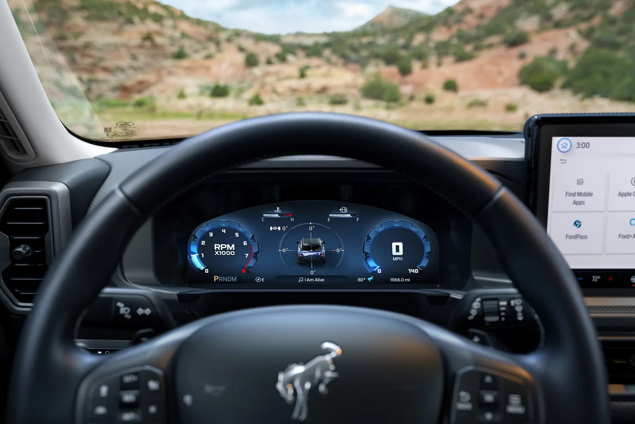 Driver’s view of the digital gauge cluster in a 2026 Ford Bronco Sport