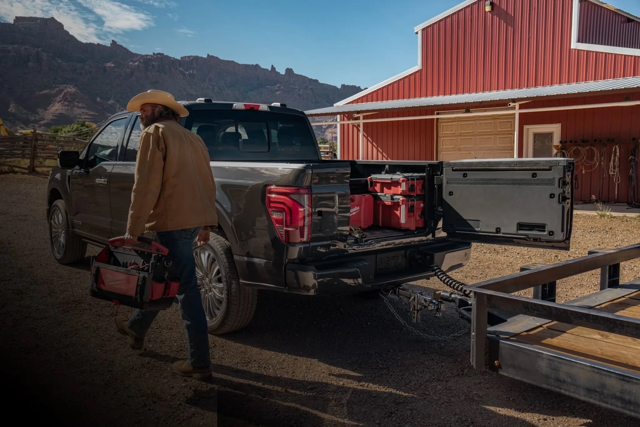 2026 Ford F-150 parked near a building with people and gear