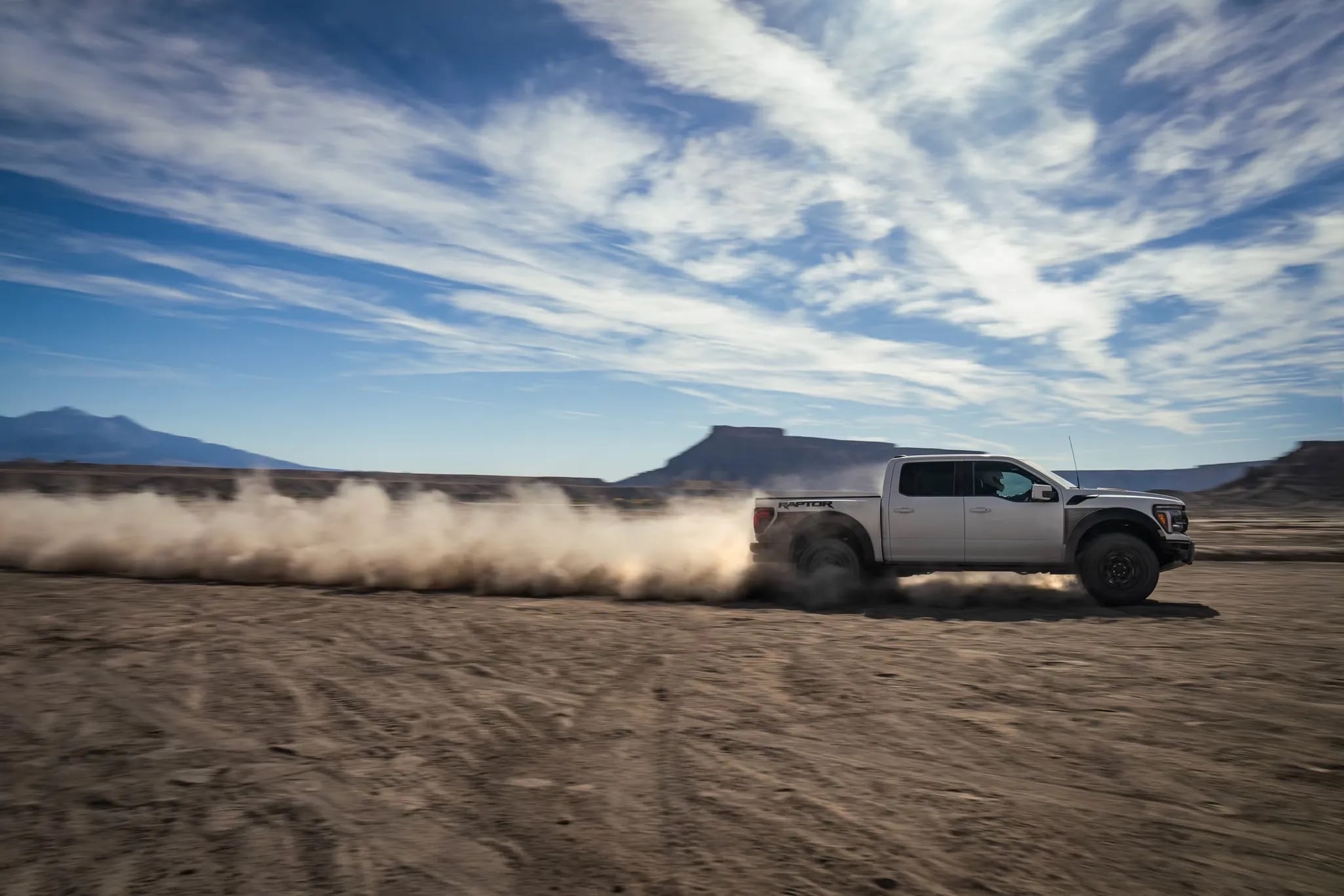 2026 Ford F-150 driving across an open desert landscape