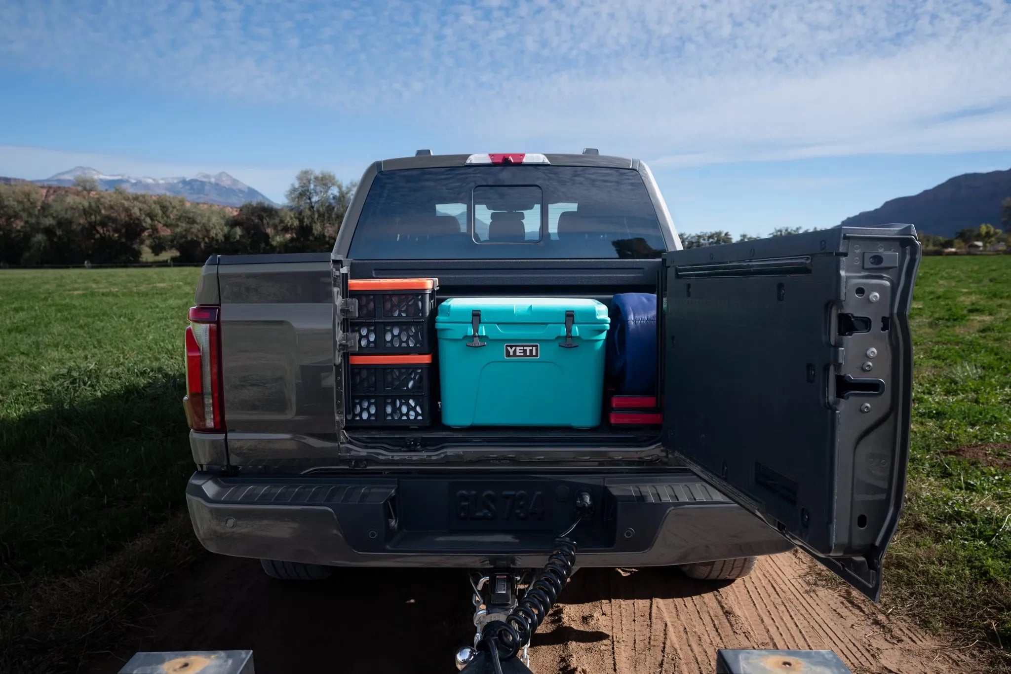 Rear view of a 2026 Ford F-150 with tailgate and truck bed open