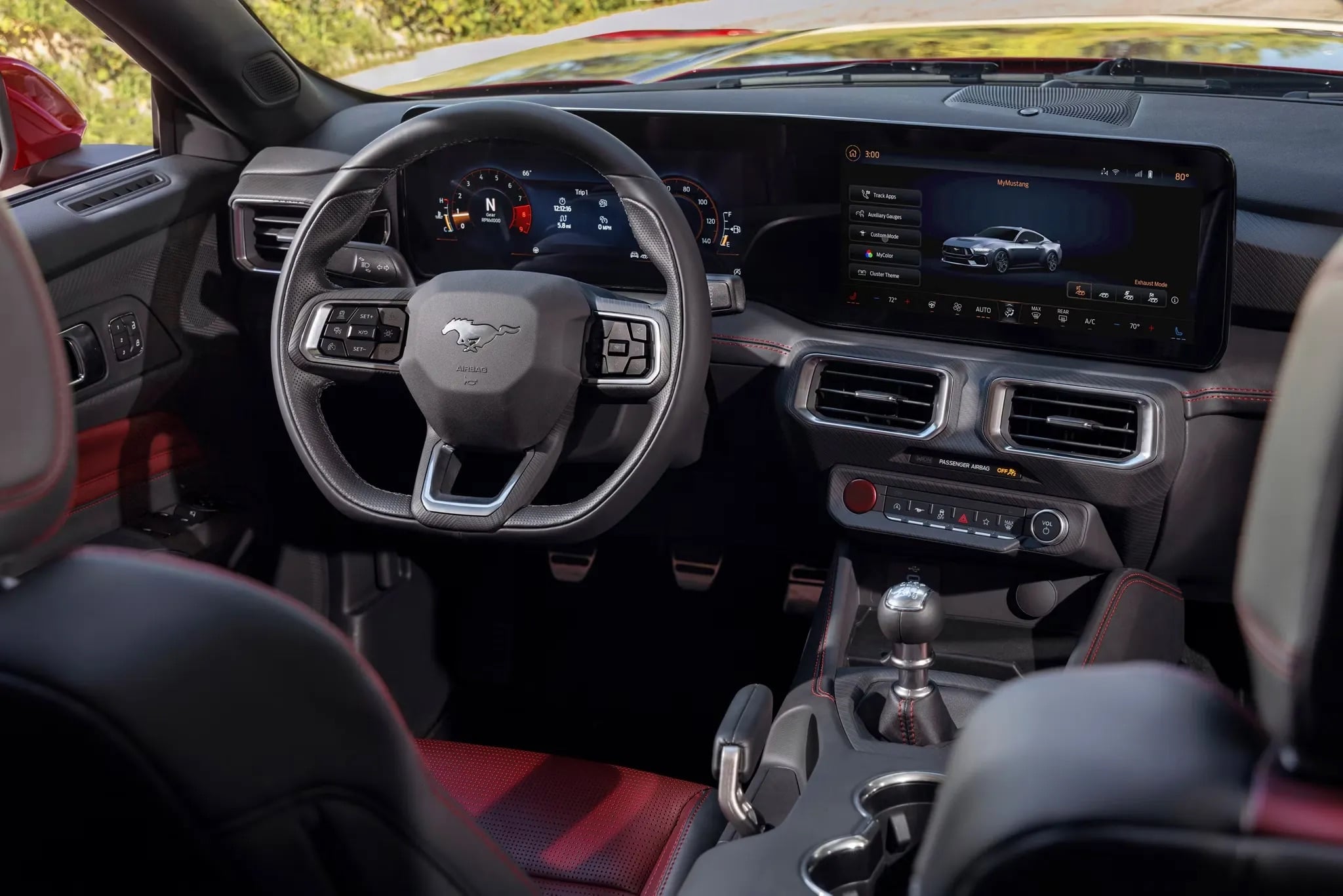 2026 Ford Mustang dashboard featuring a 12.4-inch digital instrument cluster, 13.2-inch touchscreen infotainment display, Ambient Lighting with MyColor®, and driver-focused controls.