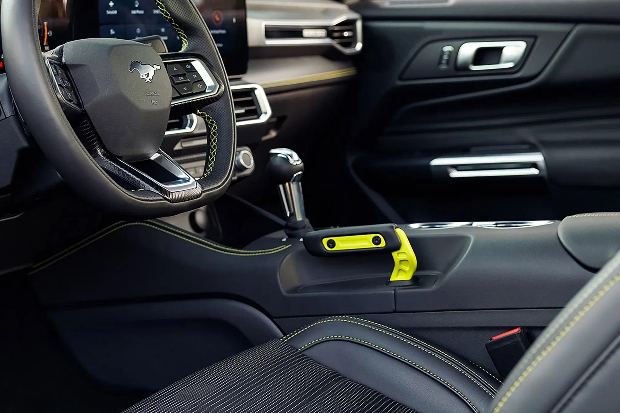 2026 Ford Mustang interior featuring the gear shifter, leather-wrapped center console, and driver-focused cabin design with premium finishes and performance-inspired details.