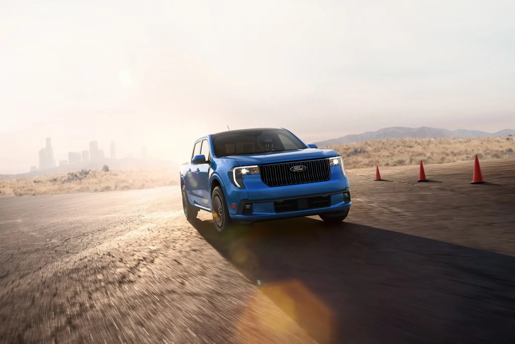 2026 Ford Maverick driving on dirt road kicking up dust performance shot