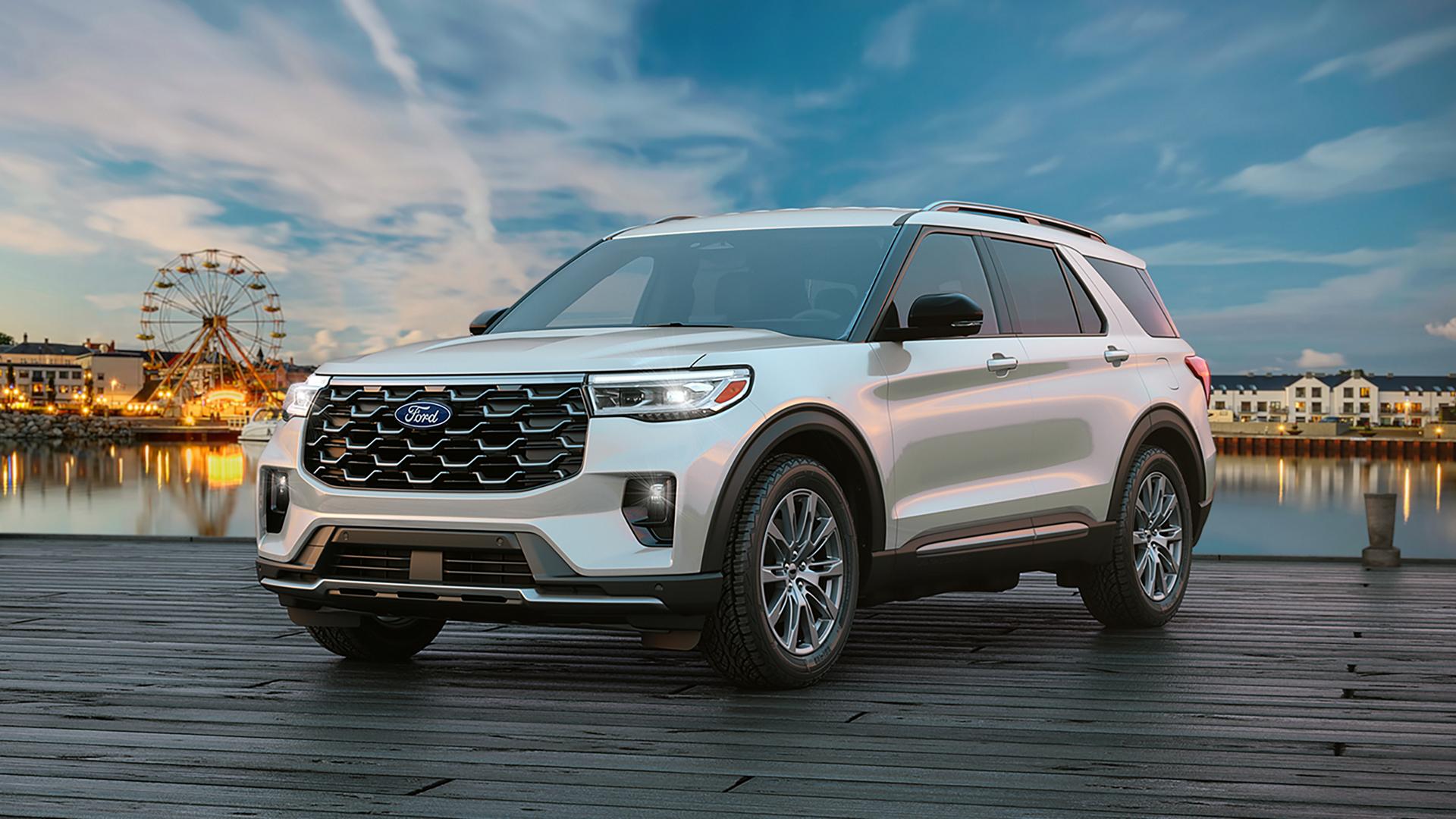 Silver Ford Explorer parked beside the water at sunset
