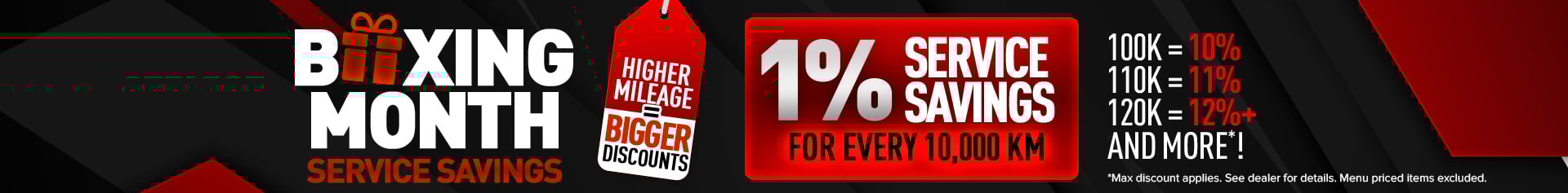 A bold red and black promotional graphic with the words “Boxing Month Service Savings.” A red gift icon replaces the “O” in “Boxing.” A large red tag reads “Higher Mileage = Bigger Discounts.” A glowing red box displays “1% Service Savings for Every 10,000 KM.” Beside it, mileage examples show “100K = 10%, 110K = 11%, 120K = 12%+ and more.”