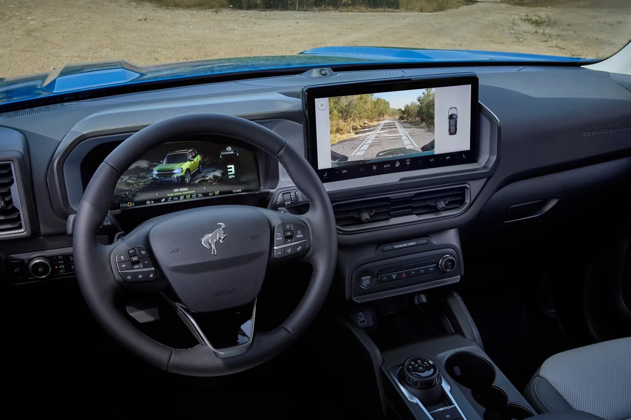 Interior dashboard and steering wheel of a 2026 Ford Bronco Sport