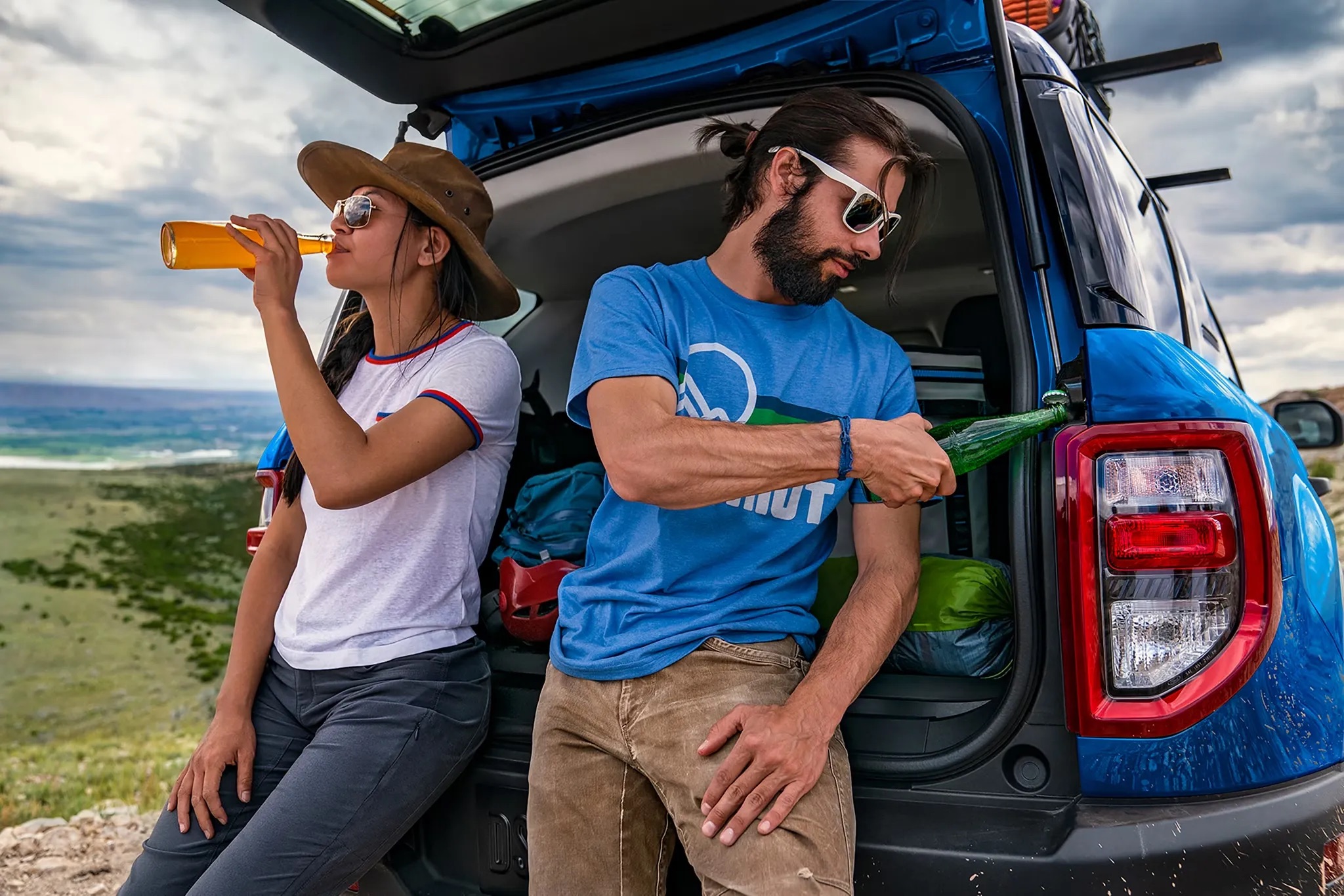 People standing beside the open rear of a 2026 Ford Bronco Sport