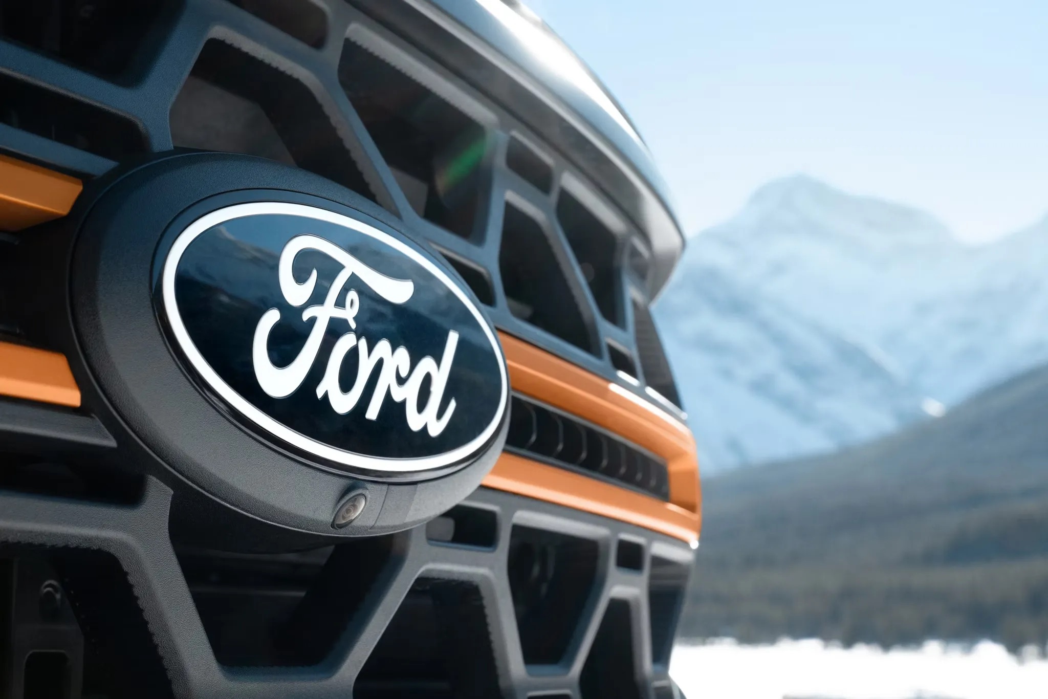 Close-up of the front grille badge on a 2026 Ford F-150
