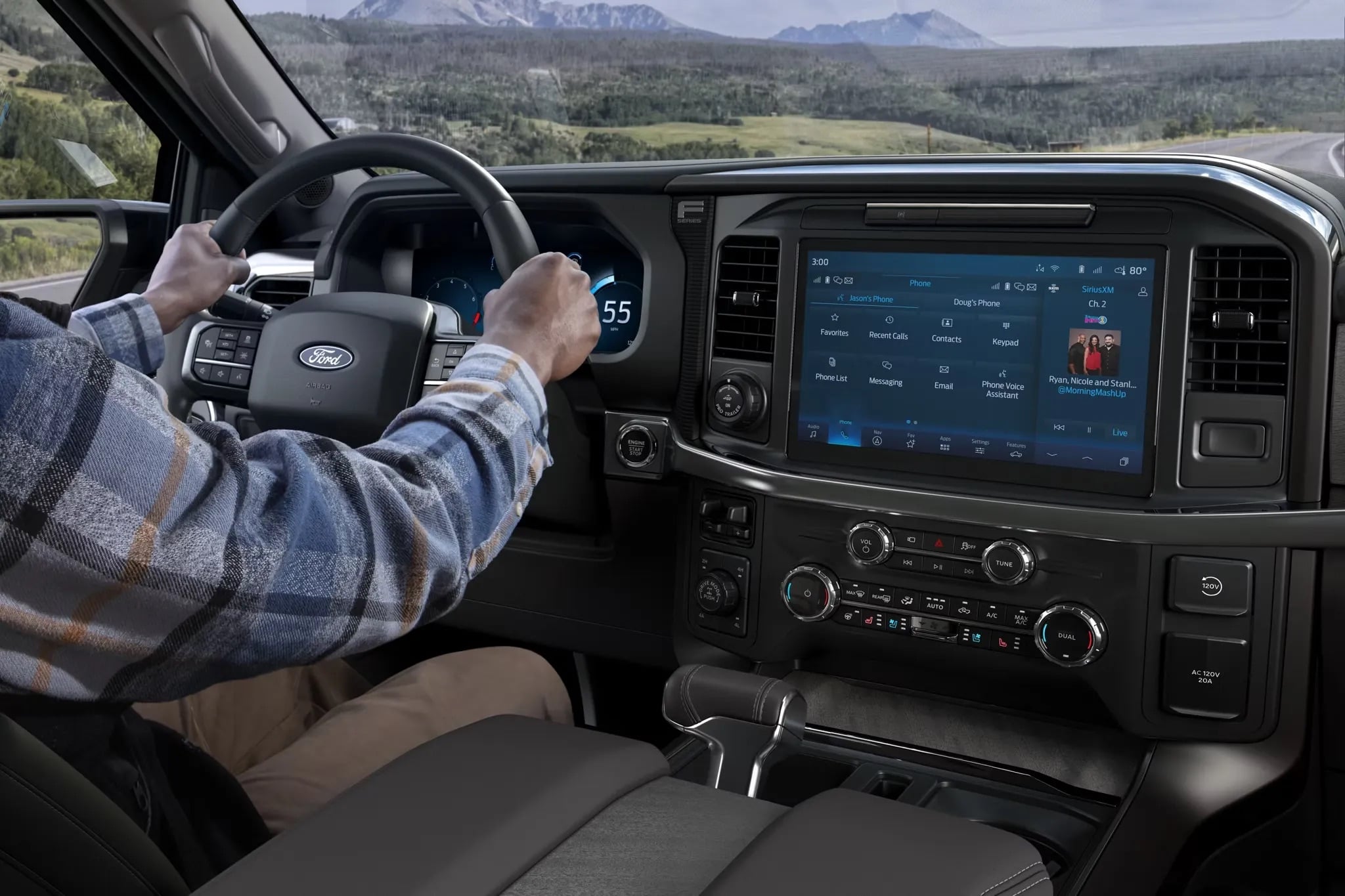 Driver using the infotainment screen inside a 2026 Ford F-150