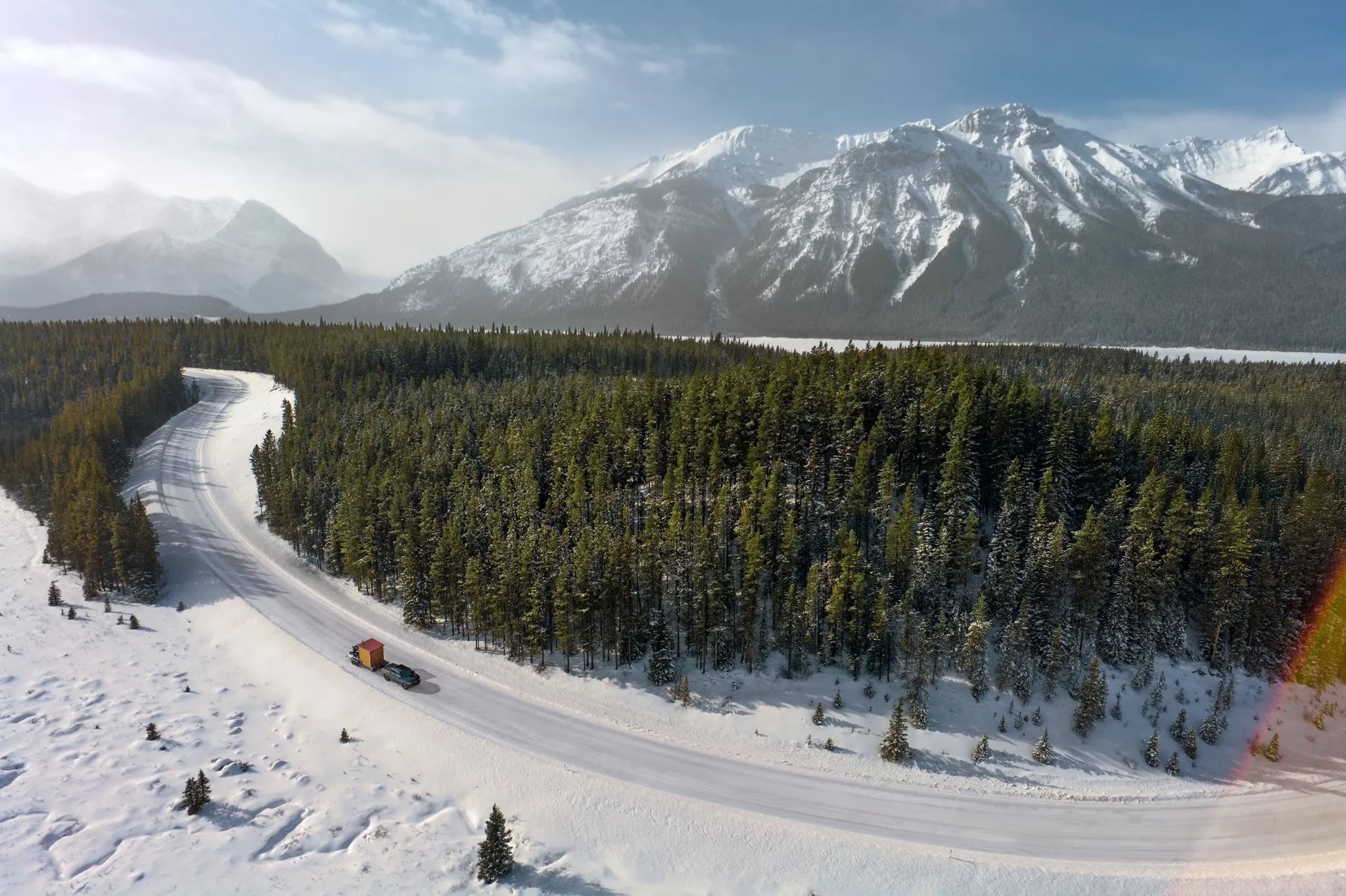 2026 Ford F-150 driving along a snowy mountain road