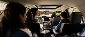 Interior view of passengers seated inside the Ford Expedition during a road trip.