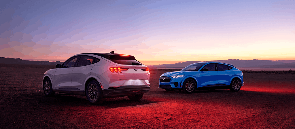 2026 Ford Mustang Mach-E lineup of electric SUVs parked in desert landscape