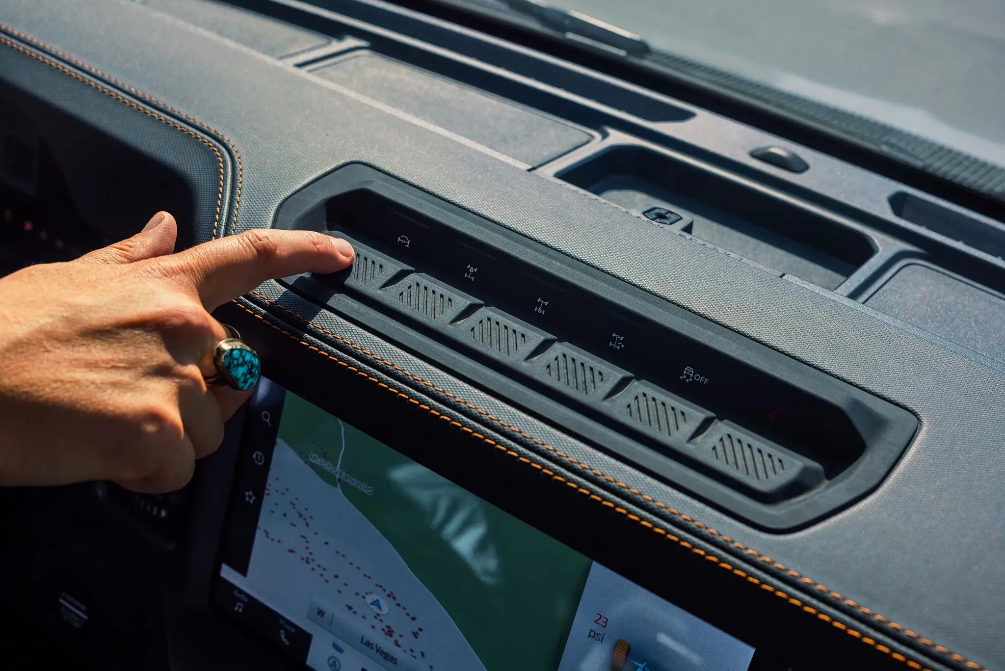 2026 Ford Bronco driver interacting with infotainment screen interior