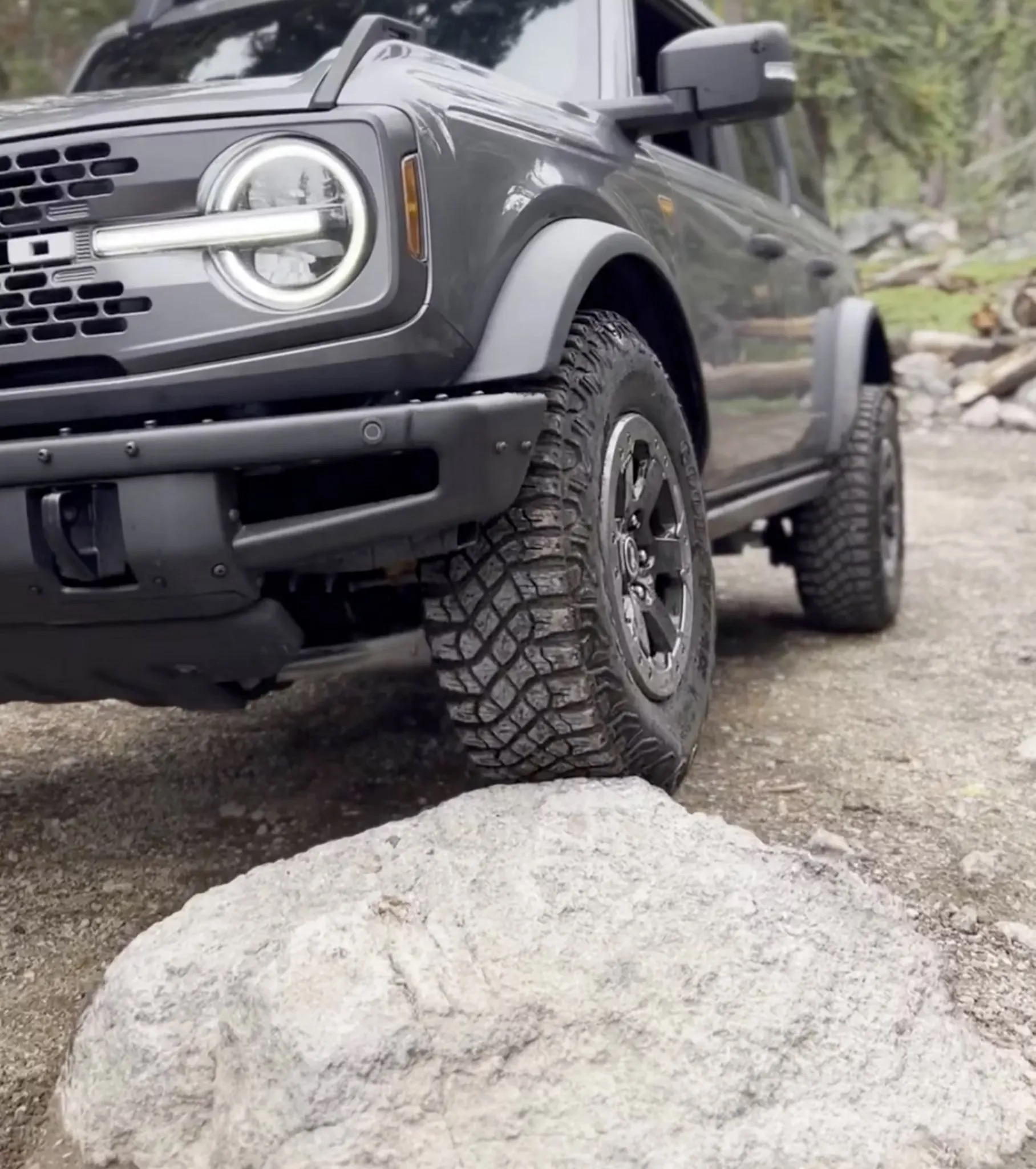 2026 Ford Bronco front suspension and tire climbing rock obstacle