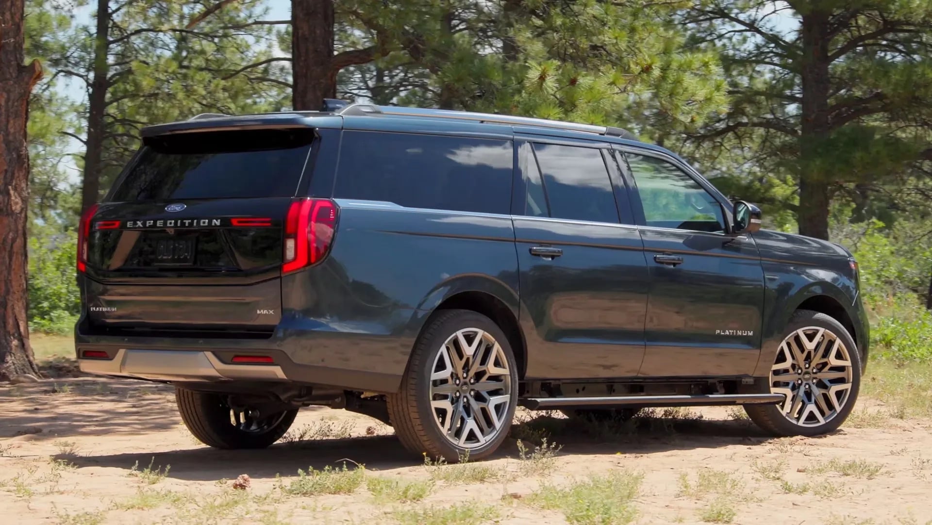 2026 Ford Expedition rear three quarter view parked in wooded area