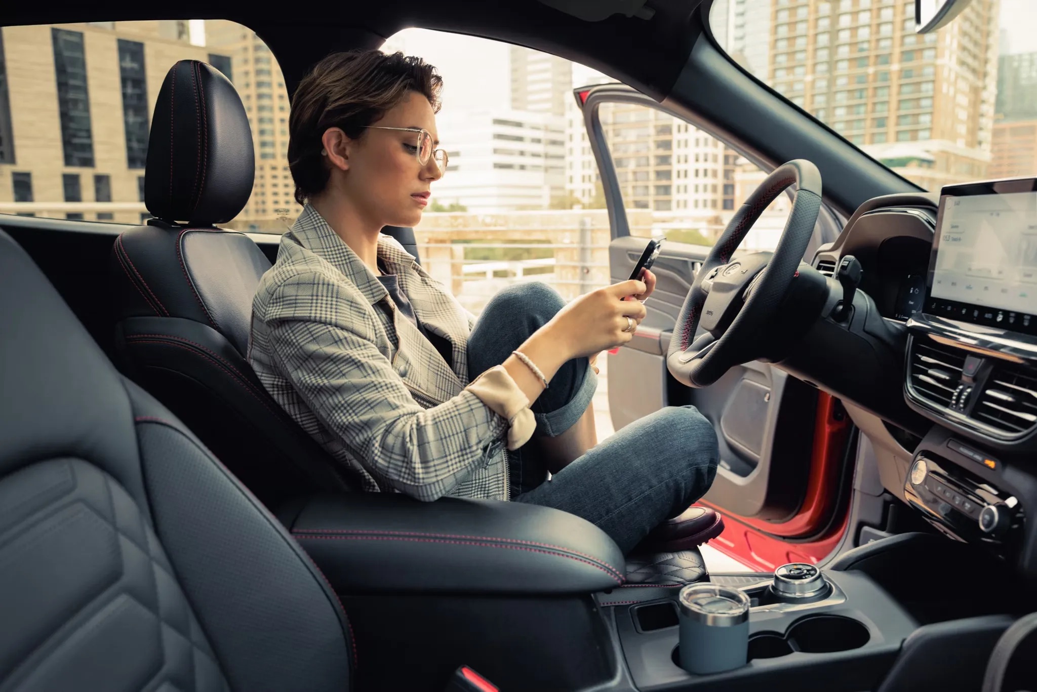 2026 Ford Mustang driver using infotainment system inside cabin