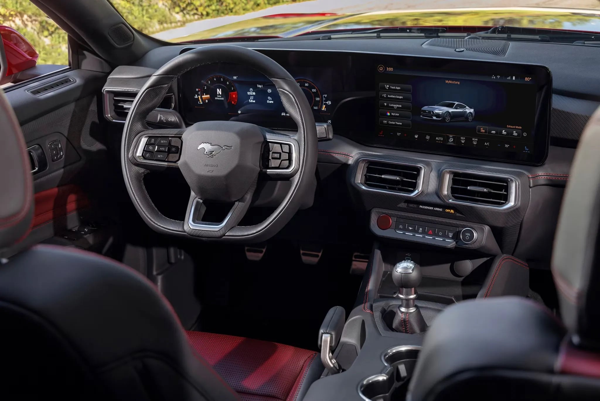 2026 Ford Mustang driver using infotainment system inside cabin