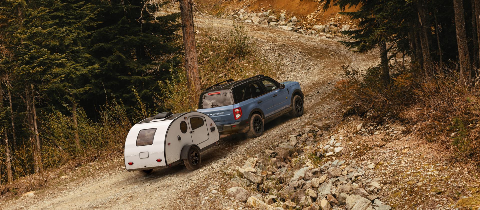 2026 Ford Bronco Sport driving along a wooded trail
