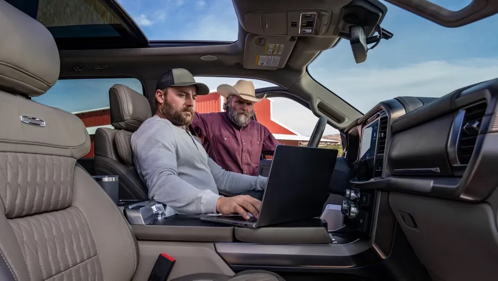 Passengers relaxing inside a pickup truck cabin