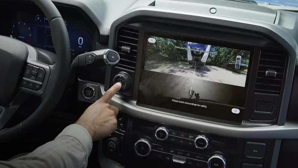 Vehicle interior with driver using a touchscreen display