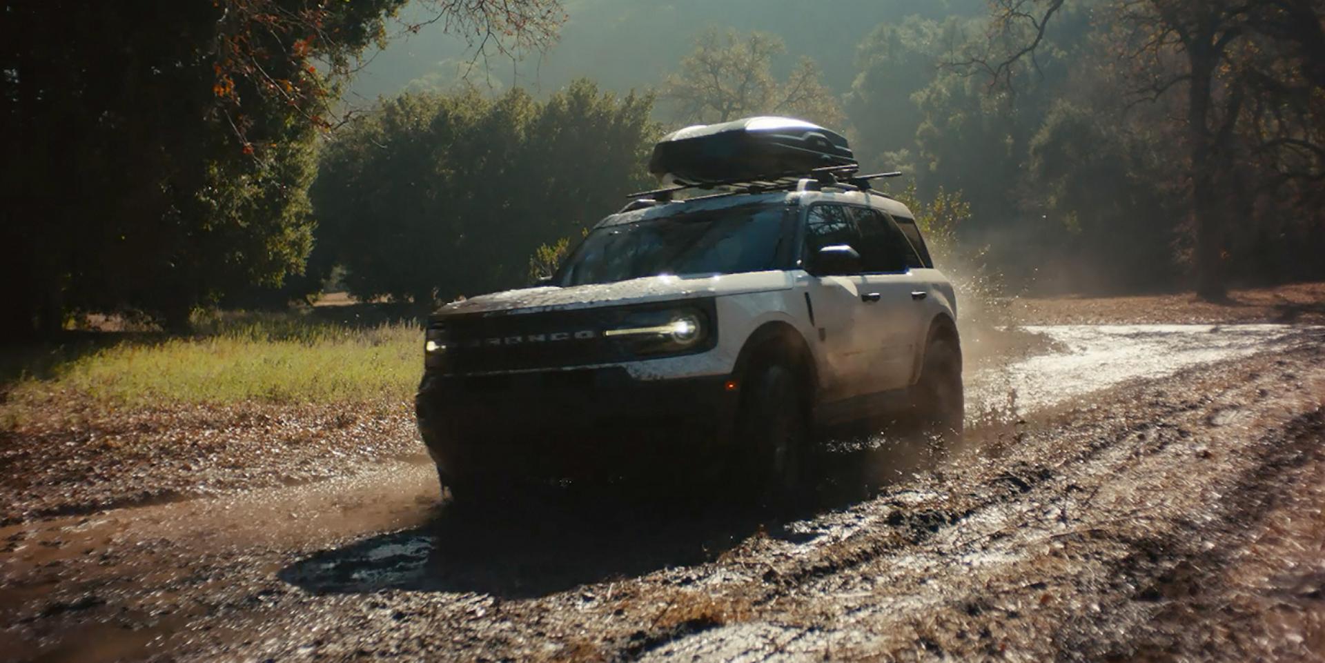 2026 Ford Bronco Sport driving through muddy terrain