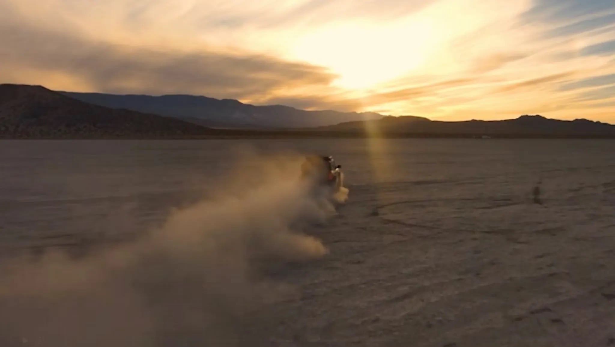 2026 Ford Bronco driving across desert kicking up dust trail