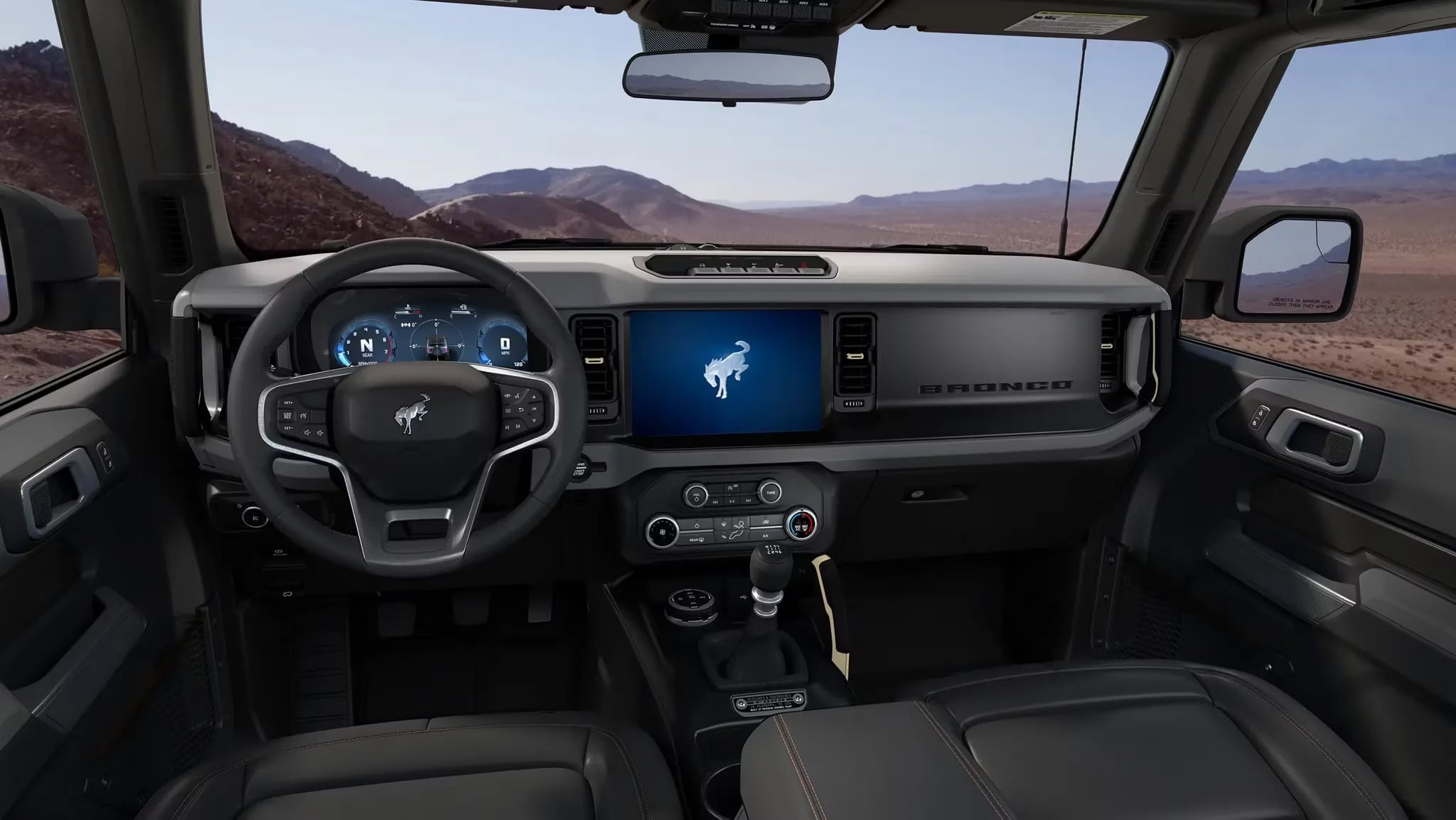 2026 Ford Bronco interior dashboard with steering wheel and infotainment system