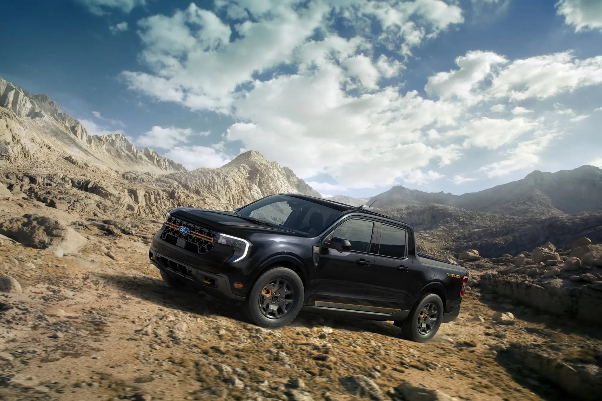 2026 Ford Maverick off road driving through rocky terrain compact truck capability