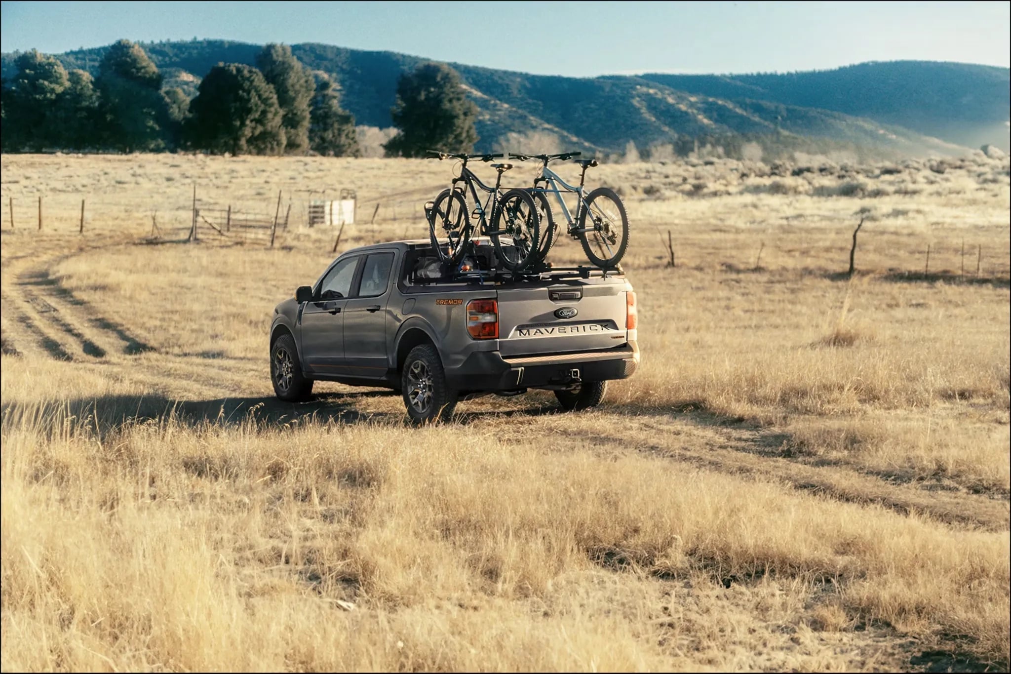 2026 Ford Maverick parked in field with bikes loaded in bed outdoor lifestyle
