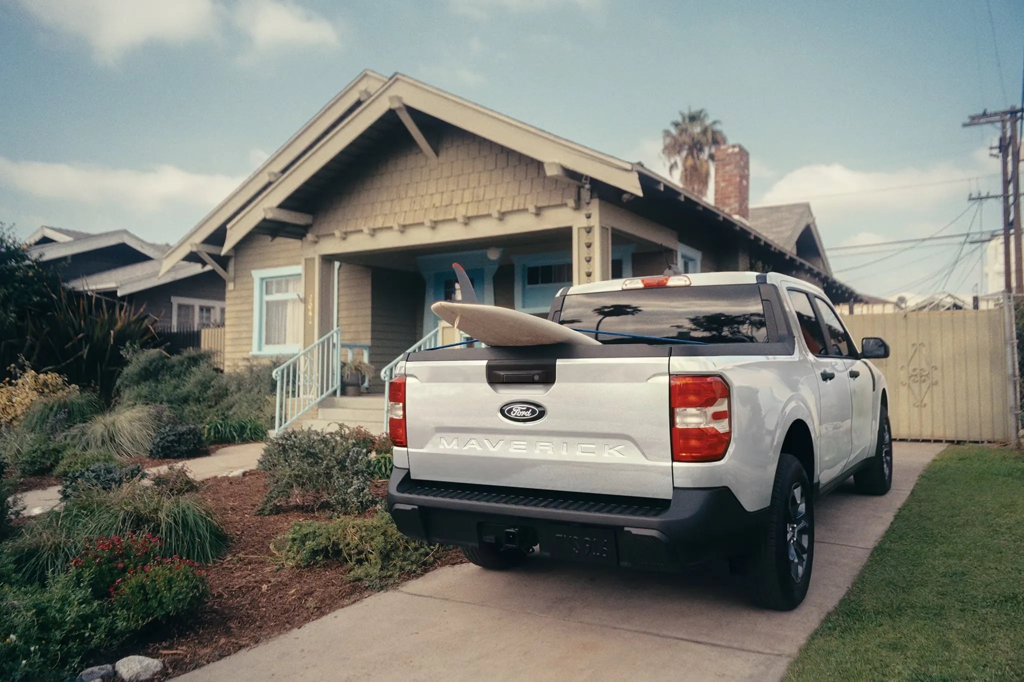 2026 Ford Maverick rear view parked outside home showing truck bed