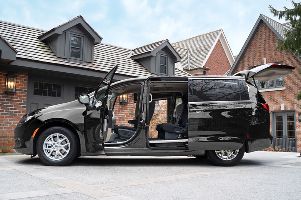 2026 Chrysler Grand Caravan parked in a driveway with doors open, showing spacious cabin and easy access