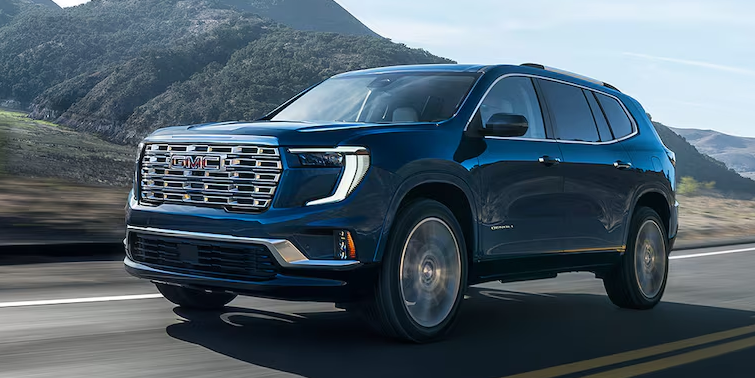 Front-side view of the 2025 GMC Acadia driving alone