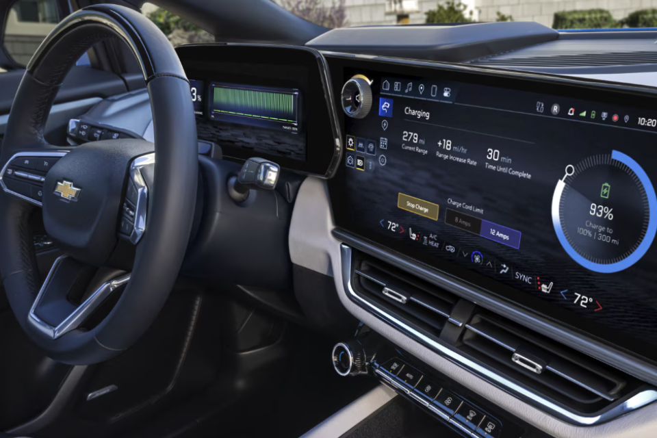 Interior of the 2026 Chevrolet Equinox EV featuring a large digital touchscreen and advanced driver display with charging details