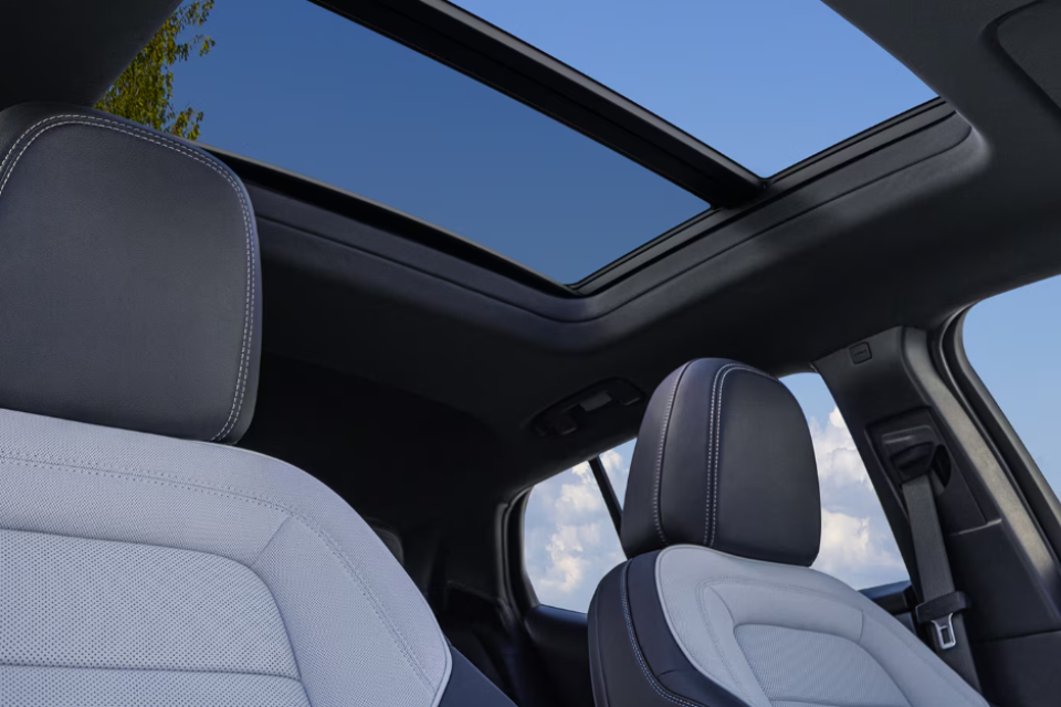 Interior view of the 2026 Chevrolet Equinox EV showing the panoramic sunroof and premium seating