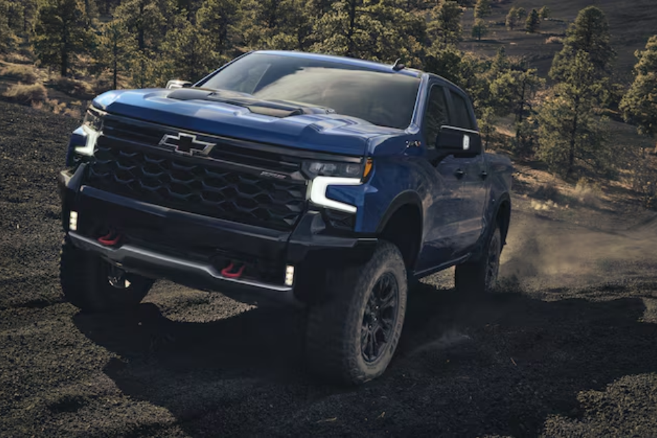 2026 Chevrolet Silverado 1500 ZR2 tackling a steep, rocky incline, demonstrating its rugged off-road capability