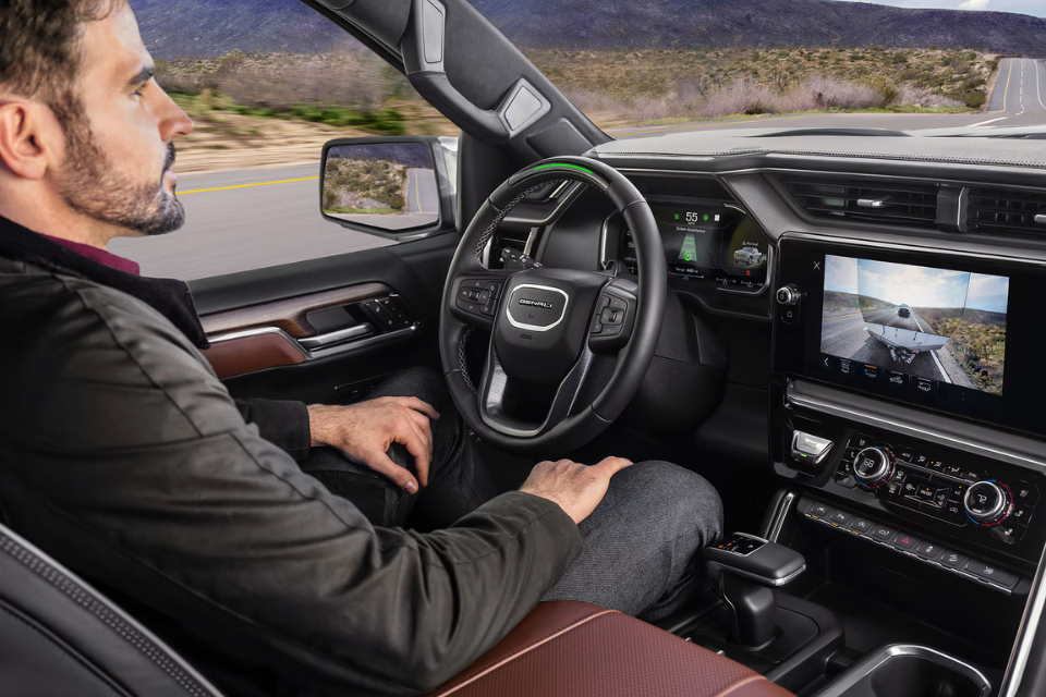 2026 GMC Sierra 1500 interior featuring a modern dashboard with a digital display, touchscreen infotainment system, and premium finishes
