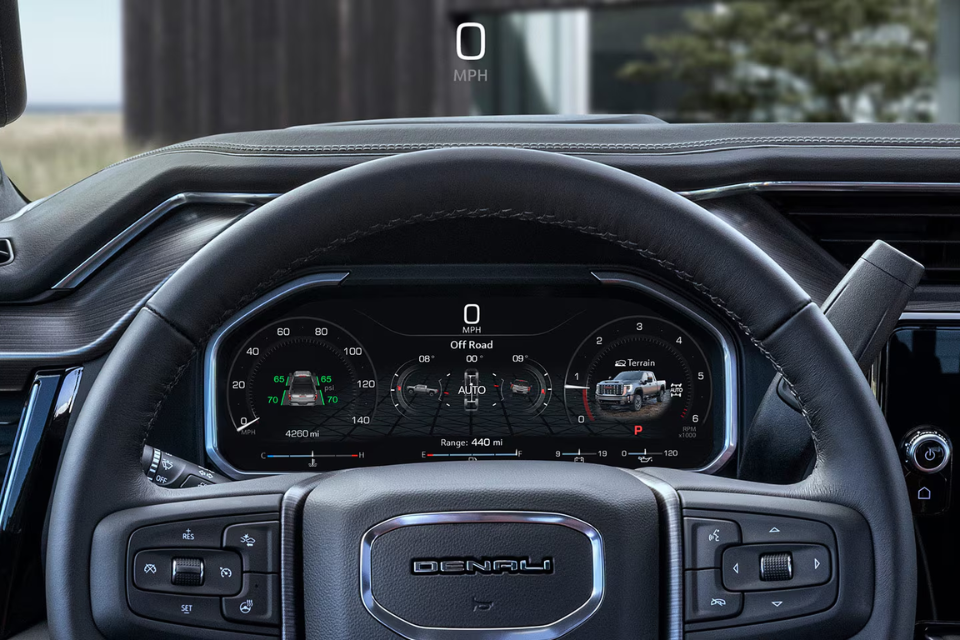 Driver’s view of the 2026 GMC Sierra HD digital instrument cluster displaying off-road performance information