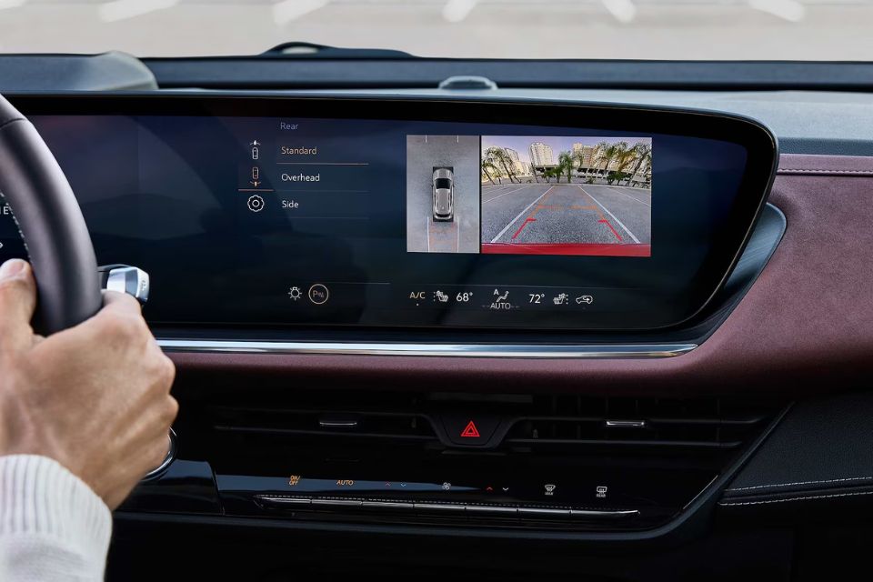 Buick Envision infotainment screen displaying the rearview camera system with overhead and side views