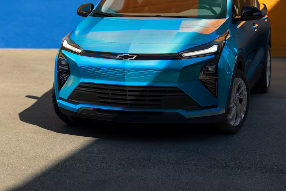 Front view of the 2027 Chevrolet Bolt EV highlighting slim LED lighting and closed-off EV grille