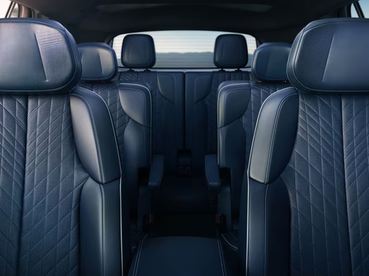 Premium blue quilted leather seats with intricate stitching inside the 2026 Cadillac VISTIQ’s spacious cabin